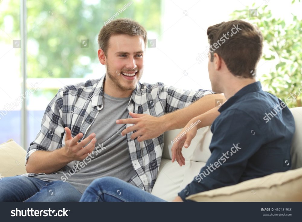 stock-photo-two-friends-talking-sitting-in-a-couch-in-the-living-room-with-a-window-in-the-background-at-home-457481938.jpg
